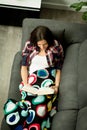 Pretty brunette girl reading on the sofa Royalty Free Stock Photo