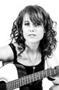 Pretty Brunette Guitar Player Royalty Free Stock Photo