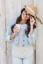 Pretty brunette holding take away coffee Royalty Free Stock Photo