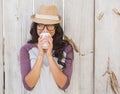 Pretty brunette holding take away coffee Royalty Free Stock Photo