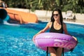 Lady holding rubber ring standing in the swimming pool Royalty Free Stock Photo