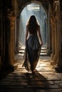 pretty brunette princess sorceress witch woman walking in a palace hall corridor. stone floor and columns. long blue dress.