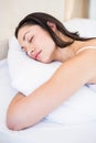 Pretty brunette sleeping on bed Royalty Free Stock Photo