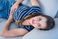 Pretty brunette suffering from stomach pain Royalty Free Stock Photo