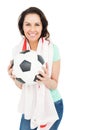 Pretty brunette with thumbs up holding soccer ball