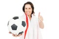 Pretty brunette with thumbs up holding soccer ball