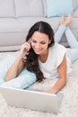 Pretty brunette using her laptop Royalty Free Stock Photo