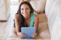 Pretty brunette using her tablet pc Royalty Free Stock Photo