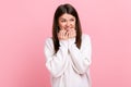 Pretty brunette woman biting nails, being nervous terrified, feeling frightened, anxiety disorder. Royalty Free Stock Photo