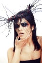 Pretty brunette woman with make up like demon at halloween, closeup scary Royalty Free Stock Photo