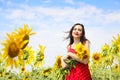 Pretty brunette woman in sunflower field Royalty Free Stock Photo