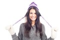 Pretty brunette woman with a woolen Peruvian hat a sweater and gloves smiling