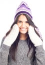 brunette woman with a woolen Peruvian hat a sweater and gloves smiling and cheerful