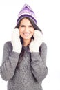 Pretty brunette woman with a woolen Peruvian hat a sweater and gloves smiling and cheerful