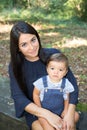 Pretty brunette young woman with long hairs with cute son child boy Royalty Free Stock Photo