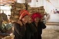 Pretty Burmese woman carrying bundles of wood