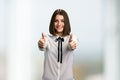 Pretty business lady gesturing thumbs up. Royalty Free Stock Photo