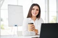 Pretty business woman with cup of coffee relax during break time Royalty Free Stock Photo