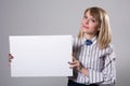 Pretty business woman holding a blank sign Royalty Free Stock Photo