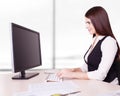 Pretty business woman at office desk