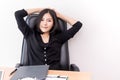 Pretty business woman relaxing and sitting in chair Royalty Free Stock Photo