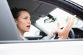 Pretty businesswoman experiencing road rage Royalty Free Stock Photo