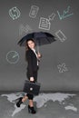 Pretty businesswoman holding umbrella