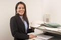 Pretty businesswoman making copies Royalty Free Stock Photo