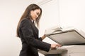 Pretty businesswoman making copies Royalty Free Stock Photo