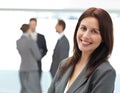 Pretty businesswoman posing in front of her team Royalty Free Stock Photo