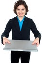 Pretty businesswoman presenting a laptop Royalty Free Stock Photo