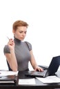 Pretty businesswoman working on laptop