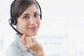 Pretty call centre agent smiling at the camera Royalty Free Stock Photo