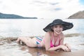 A pretty and carefree asian lady at a tropical beach, posing with her new bikini. At Nasugbu, Batangas, Philippines Royalty Free Stock Photo