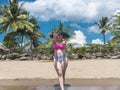 A pretty and carefree asian lady at a tropical beach, posing with her new bikini. At Nasugbu, Batangas, Philippines Royalty Free Stock Photo