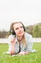 Pretty carefree girl listening music during recreation time Royalty Free Stock Photo