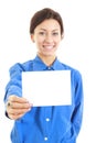 Pretty casual woman holding her large blank visiting card Royalty Free Stock Photo