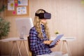 Pretty casual worker using oculus rift Royalty Free Stock Photo