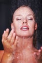 Pretty Caucasian woman having a bath under a shower. Hygiene - Closeup of a pretty Caucasian woman under a shower , dark