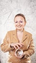 Pretty caucasian woman with her hands with crystal ball predicting the future on white background Royalty Free Stock Photo