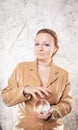 Pretty caucasian woman with her hands with crystal ball predicting the future on white background Royalty Free Stock Photo