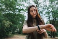 Pretty caucasian woman uses fitness tracker during sports training Royalty Free Stock Photo