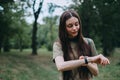 Pretty caucasian woman uses fitness tracker during sports training Royalty Free Stock Photo