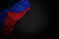 Pretty celebration flag 3d illustration - dark photo of Donetsk Peoples Republic flag with large folds on black stone with free