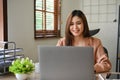 Asian businesswoman or female manager working on her project on laptop Royalty Free Stock Photo