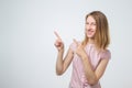 Pretty cheerful european woman gesturing with fingers and showing away Royalty Free Stock Photo