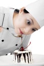 Pretty chef garnish a delicious cake Royalty Free Stock Photo