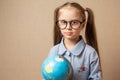Cute little girl with globe. Royalty Free Stock Photo