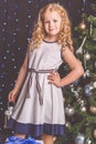 Pretty child girl near decorated christmas tree Royalty Free Stock Photo