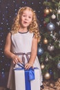 Pretty child girl near decorated christmas tree Royalty Free Stock Photo